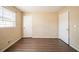 Bedroom showcasing wood-look floors, a window, and two doors at 4023 Snapfinger Way, Decatur, GA 30035