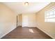 Bright bedroom with wood-look floors and a window at 4023 Snapfinger Way, Decatur, GA 30035