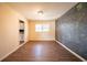Spacious room with chalkboard wall and view to adjacent kitchen, ready for remodel at 4023 Snapfinger Way, Decatur, GA 30035