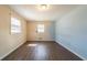 Cozy bedroom with natural light from the windows and hardwood floors at 4023 Snapfinger Way, Decatur, GA 30035