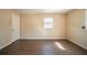 Bedroom featuring hardwood floors, a large window, and ample closet space at 4023 Snapfinger Way, Decatur, GA 30035