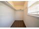 Empty walk-in closet with shelving and wood-look flooring at 4023 Snapfinger Way, Decatur, GA 30035