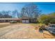 Two story home with a long driveway in need of repair at 4023 Snapfinger Way, Decatur, GA 30035