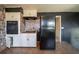 Galley kitchen with updated cabinetry and black appliances at 4023 Snapfinger Way, Decatur, GA 30035