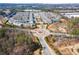 Aerial view of a neighborhood with manicured lawns, walking trails and a community pool at 10162 Windalier Way, Roswell, GA 30076