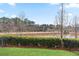 Picturesque backyard featuring a lush lawn and tranquil waterfront views at 10162 Windalier Way, Roswell, GA 30076