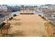 Aerial view of a community open space surrounded by townhomes and landscaping at 10162 Windalier Way, Roswell, GA 30076