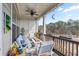 Relaxing screened porch with comfortable seating, ceiling fan and tranquil views of the surrounding landscape at 10162 Windalier Way, Roswell, GA 30076