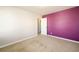 Bedroom showing a single accent wall, neutral carpet, and an interior door at 103 Magnaview Dr, Mcdonough, GA 30253