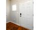 Entryway with hardwood floors and a white door, creating a welcoming and clean aesthetic at 103 Magnaview Dr, Mcdonough, GA 30253