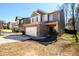 View of a two-story home featuring a brick-accented facade, attached two-car garage, and landscaping at 103 Magnaview Dr, Mcdonough, GA 30253