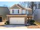 Charming two-story home with a brick-accented facade and an attached two-car garage at 103 Magnaview Dr, Mcdonough, GA 30253