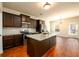 Spacious kitchen with granite countertops, stainless steel appliances, and dark wood cabinets at 103 Magnaview Dr, Mcdonough, GA 30253