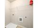 This laundry room has utility connections and a wire shelf at 103 Magnaview Dr, Mcdonough, GA 30253