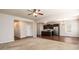 Spacious living room with a view into the kitchen and dining area, featuring neutral carpeting at 103 Magnaview Dr, Mcdonough, GA 30253