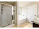 This main bathroom features a shower, bathtub, and neutral color scheme at 103 Magnaview Dr, Mcdonough, GA 30253