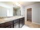 This main bathroom features dual vanities and a door to the walk-in closet at 103 Magnaview Dr, Mcdonough, GA 30253