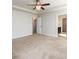 This main bedroom features a ceiling fan, tray ceiling, and carpet flooring at 103 Magnaview Dr, Mcdonough, GA 30253