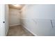 This walk-in closet has wire shelves and carpet flooring at 103 Magnaview Dr, Mcdonough, GA 30253