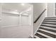 Finished basement area with neutral carpet and wood stairs with white risers at 1937 Quarry Park Nw Pl, Atlanta, GA 30318