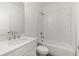 Modern bathroom with a subway-tiled shower over tub, white vanity and brushed nickel fixtures at 1937 Quarry Park Nw Pl, Atlanta, GA 30318