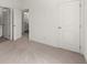 Bedroom boasts carpet and multiple doors for convenient access and privacy at 1937 Quarry Park Nw Pl, Atlanta, GA 30318