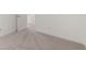 Carpeted bedroom with neutral walls and white trim at 1937 Quarry Park Nw Pl, Atlanta, GA 30318