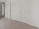 Bedroom featuring carpet, white trim, and double doors at 1937 Quarry Park Nw Pl, Atlanta, GA 30318
