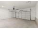 Spacious two-car garage with an automatic door and access door to the house at 1937 Quarry Park Nw Pl, Atlanta, GA 30318