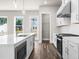 Well-equipped kitchen with white cabinets, stainless steel appliances, and a functional center island at 1937 Quarry Park Nw Pl, Atlanta, GA 30318
