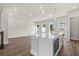 Bright, open-concept kitchen with stainless steel appliances, a center island, and hardwood floors at 1937 Quarry Park Nw Pl, Atlanta, GA 30318