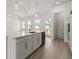 A modern kitchen featuring white cabinets, stainless steel appliances, and a center island at 1937 Quarry Park Nw Pl, Atlanta, GA 30318