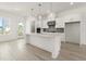 Well-lit kitchen boasts a center island, modern pendant lighting, and stainless appliances at 1937 Quarry Park Nw Pl, Atlanta, GA 30318