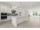 Open kitchen featuring stainless appliances, island, and view into the living room at 1937 Quarry Park Nw Pl, Atlanta, GA 30318
