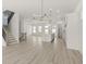 Bright living room with an open floor plan, stylish lighting and light colored wood floors at 1937 Quarry Park Nw Pl, Atlanta, GA 30318