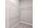 Empty walk-in closet with carpeting and basic wire shelving installed for ample storage at 1937 Quarry Park Nw Pl, Atlanta, GA 30318