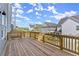 Spacious wooden deck with railing, offering views of the backyard and neighborhood at 1941 Quarry Park Nw Pl, Atlanta, GA 30318
