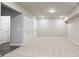 Large finished basement area with neutral carpet and ample storage space at 1941 Quarry Park Nw Pl, Atlanta, GA 30318