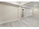 Well-lit, finished basement area featuring neutral paint, modern flooring and a large storage closet at 1941 Quarry Park Nw Pl, Atlanta, GA 30318