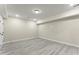 A spacious finished basement showcases the natural light and neutral color scheme at 1941 Quarry Park Nw Pl, Atlanta, GA 30318