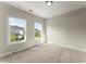 Bright bedroom with two large windows and neutral walls at 1941 Quarry Park Nw Pl, Atlanta, GA 30318