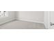Bedroom with neutral carpet, white walls, and a view of the neighborhood at 1941 Quarry Park Nw Pl, Atlanta, GA 30318