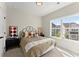 This cozy bedroom features large windows and neutral décor with a unique headboard design at 1941 Quarry Park Nw Pl, Atlanta, GA 30318