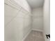 The walk-in closet has carpet, white walls, a white ceiling, and metal rack shelving at 1941 Quarry Park Nw Pl, Atlanta, GA 30318