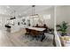 Open concept dining area with modern lighting, a marble table, and views of the kitchen at 1941 Quarry Park Nw Pl, Atlanta, GA 30318