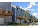 Modern townhomes featuring balconies over garages, showcasing contemporary design and curb appeal in a friendly neighborhood at 1941 Quarry Park Nw Pl, Atlanta, GA 30318