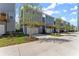 Charming row of modern townhomes featuring private balconies, single-car garages, and professionally landscaped front yards at 1941 Quarry Park Nw Pl, Atlanta, GA 30318