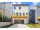 Exterior of a home with a deck over a two car garage at 1941 Quarry Park Nw Pl, Atlanta, GA 30318