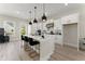 Open kitchen features white cabinets, a large island, modern appliances, and access to the deck at 1941 Quarry Park Nw Pl, Atlanta, GA 30318