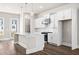Beautiful open kitchen with white cabinets, modern appliances, and a large kitchen island at 1941 Quarry Park Nw Pl, Atlanta, GA 30318